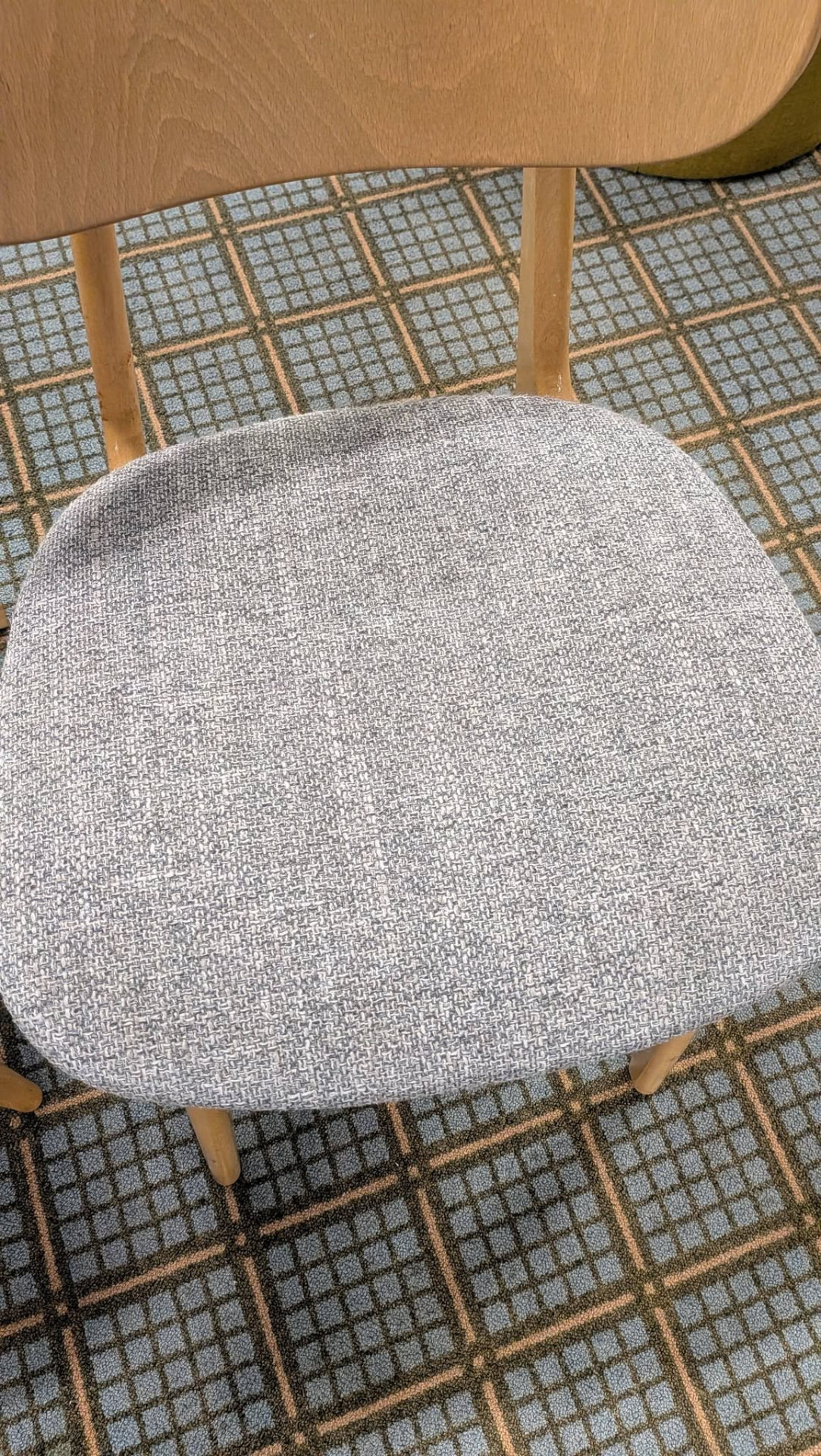 Grey upholstered wooden chair after cleaning