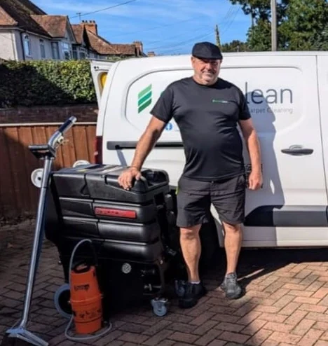 Paul Osborn beside his van and carpet cleaning equipment