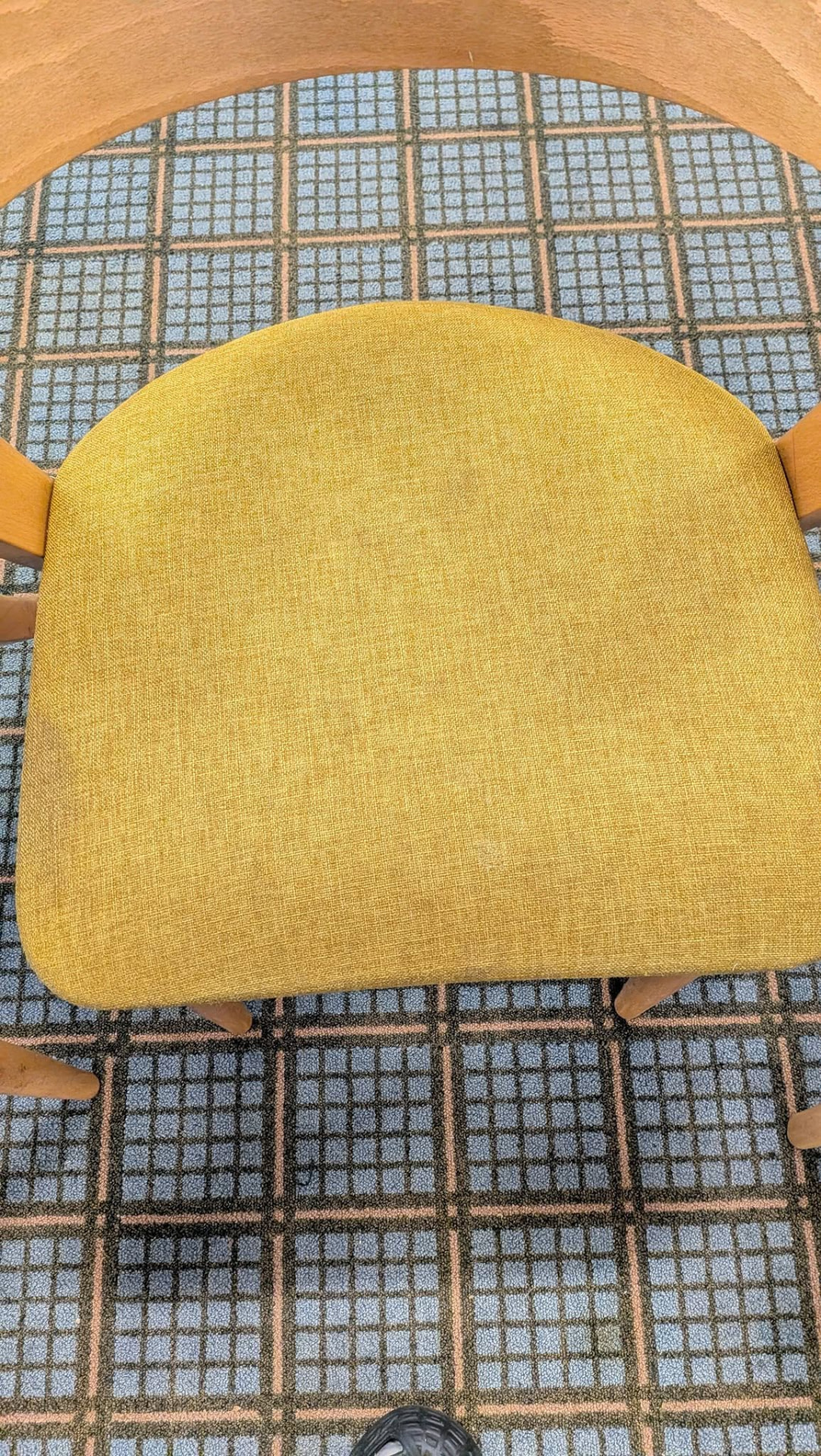 Yellow upholstered wooden chair after cleaning
