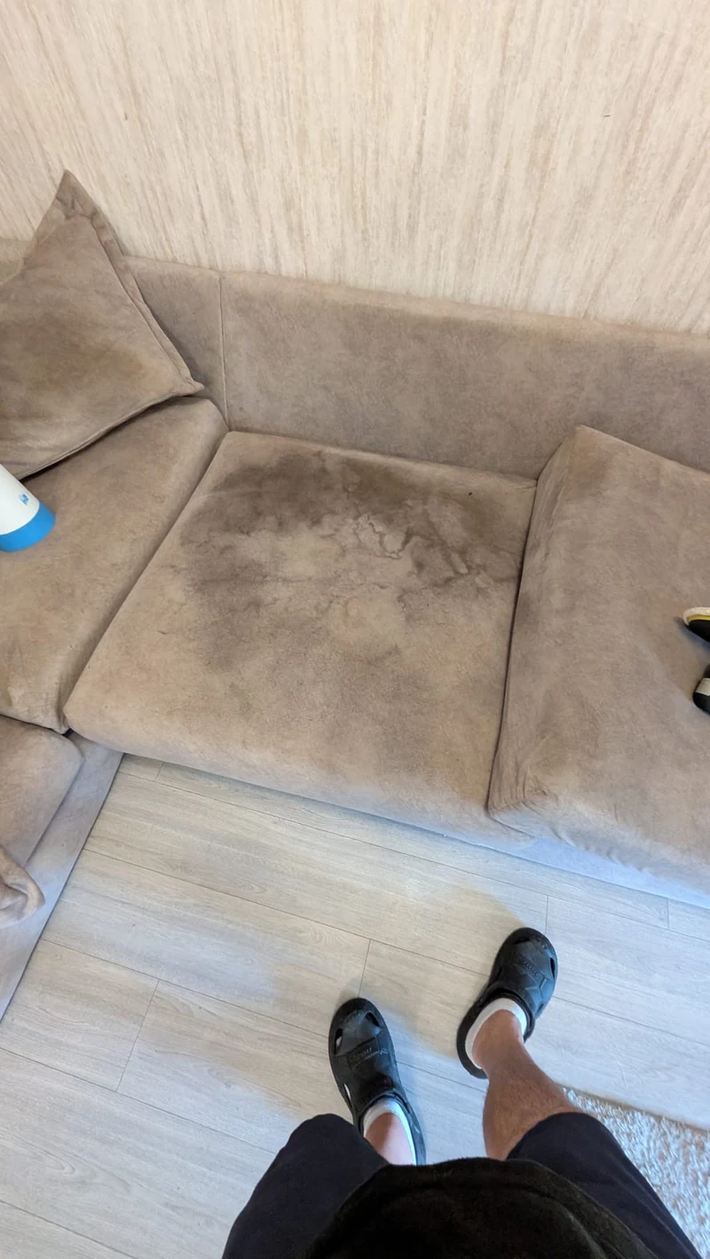 Stained sofa upholstery before cleaning